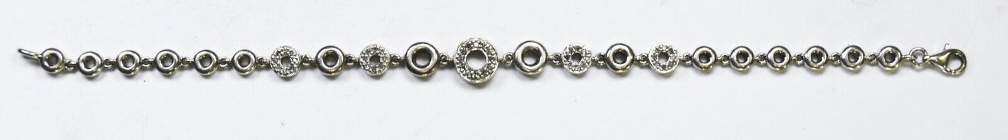 Sterling Silver Round Diamond Hoop 5mm-9mm Graduated Bracelet 7"