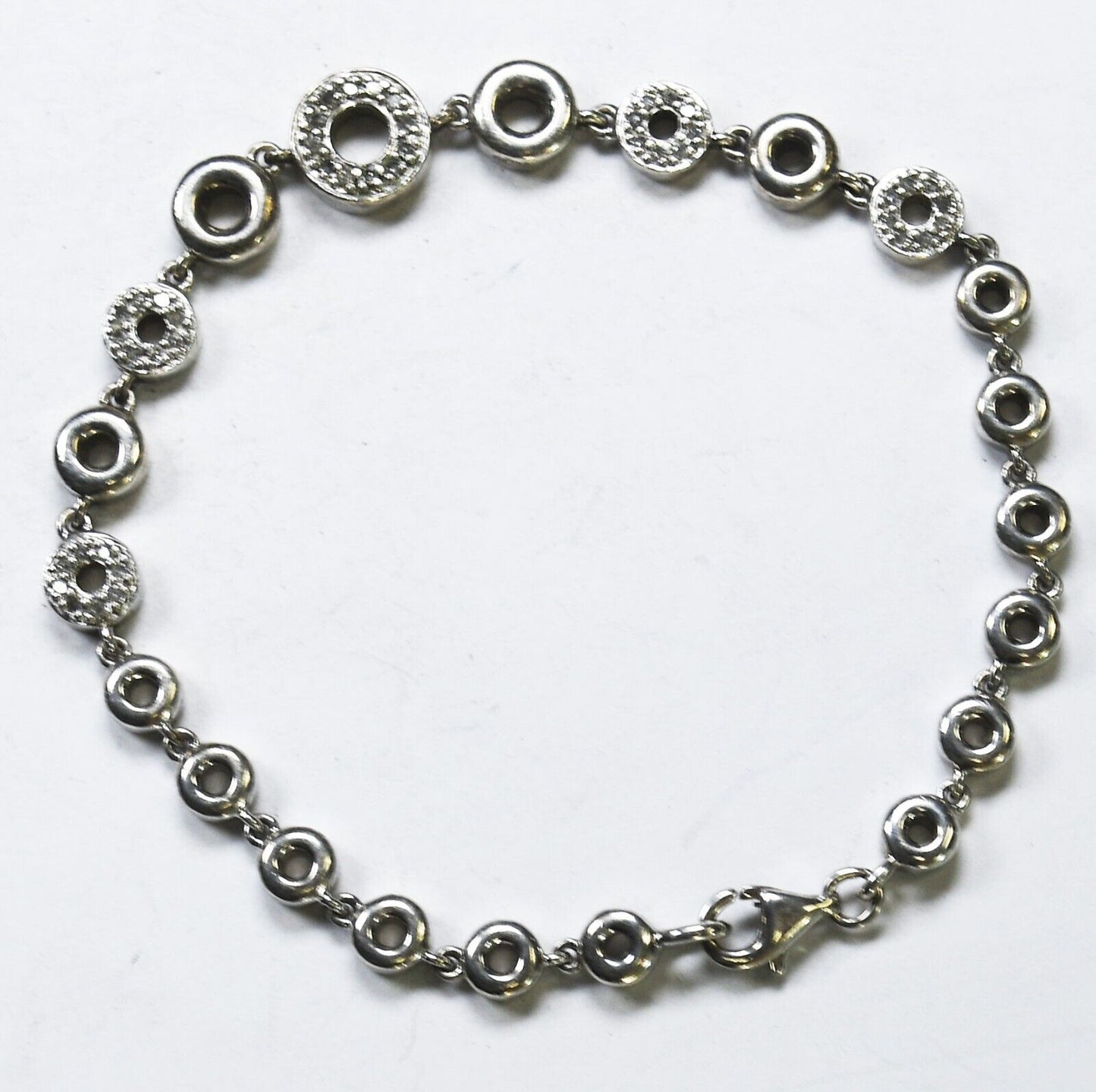 Sterling Silver Round Diamond Hoop 5mm-9mm Graduated Bracelet 7"