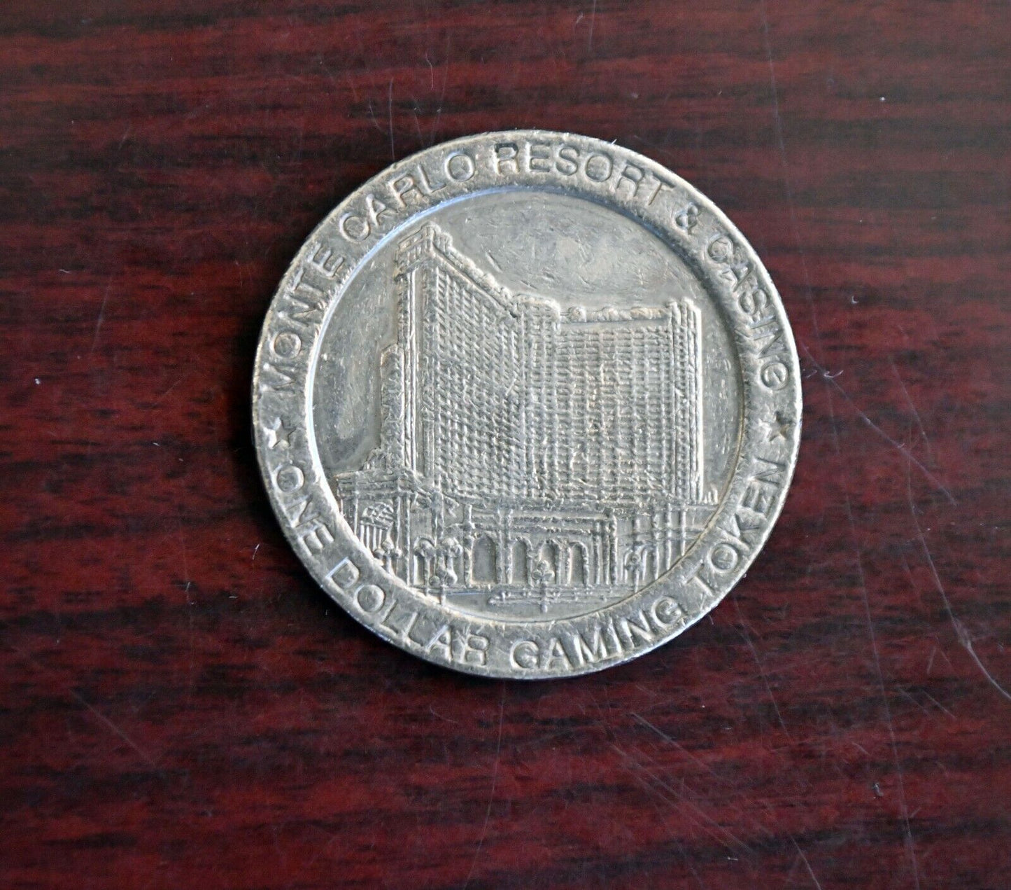 1996 Monte Carlo Resort Casino One Dollar Gaming Slot Token Las Vegas