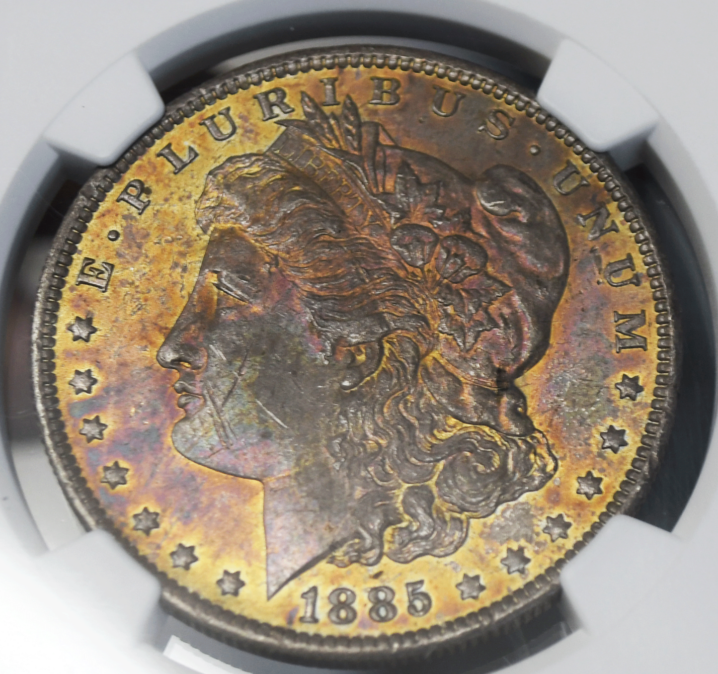 1885 O $1 Morgan Silver Dollar MS61 NGC Uncirculated Rainbow Toned