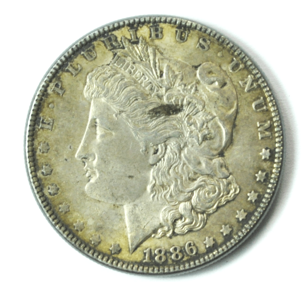 1886 $1 Morgan Silver One Dollar US Philadelphia AU Lamination Obverse
