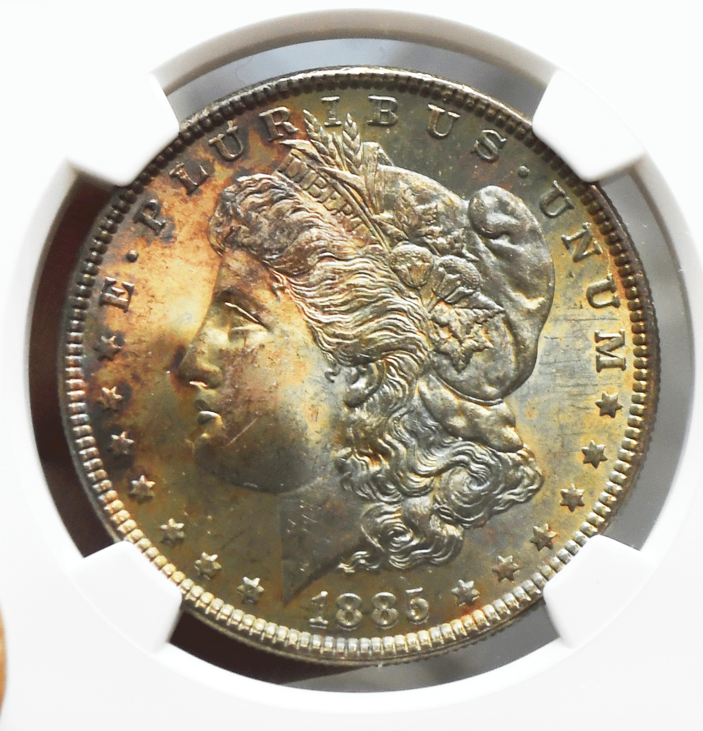 1885 $1 Morgan Silver Dollar MS64 NGC Uncirculated Philadelphia Rainbow Toned